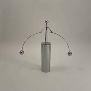 A Metal Perpetual Motion Funambulist Figurine